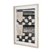 Black and white rug texture framed in washed wood