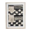 Black and white rug texture framed in washed wood