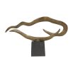 Gold wavy abstract sculpture on black plinth