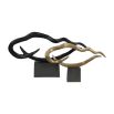 Gold wavy abstract sculpture on black plinth