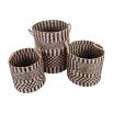 Black and white rattan baskets in a set of three