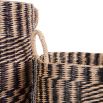 Black and white rattan baskets in a set of three