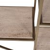 round shelving unit with brass frame and travertine marble shelves