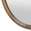 Round wall mirror framed in oak wood