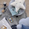 A soft and cosy star-shaped polyester cushion