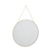 An elegant wall mirror with a dainty gold frame and chain 