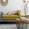 A gorgeous Nordic-inspired round oak coffee table with a removable top