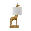 A luxurious golden giraffe-shaped table lamp with a linen shade