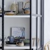 A sophisticated black crittall display cabinet with tempered glass 