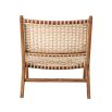 A luxurious teak and rattan lounge chair 