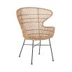 A luxurious woven rattan armchair with metal legs