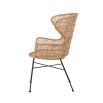 A luxurious woven rattan armchair with metal legs