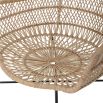 A luxurious woven rattan armchair with metal legs