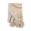 Neutral tone cotton throw with a colourful abstract design