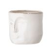 A glazed ceramic handcrafted flowerpot with abstract human facial features