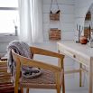 A scandi-inspired light oak chair with a braided seat