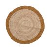 A simple yet chic circular rug crafted from jute and cotton
