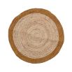 A simple yet chic circular rug crafted from jute and cotton