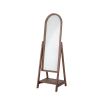 A chic standing mirror in a brown frame and a small lower shelf