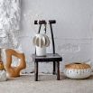 A charming pedestal by Bloomingville crafted from recycled wood