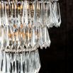 Antique gold chandelier with hanging beads and glass crystals