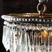 Antique gold chandelier with hanging beads and glass crystals