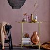 A luxurious gold and glass modern bar trolley