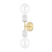 A chic white marble and aged brass dual globe wall lamp