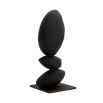 Black tiered stone-like sculpture on on gold base