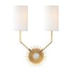 A glamorous sunburst wall sconce with dual silk lamps