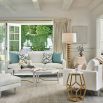 Set of two white nesting tables with brass detail