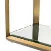 Glamorous side table with brass frame and glass surfaces