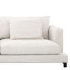 A contemporary white sofa with contrasting black legs 