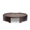 Round coffee table with wooden surface suspended between bronze legs