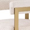 Glamorous brass frame bar stool and cream boucle upholstery