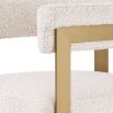 Glamorous brass frame counter stool and cream boucle upholstery