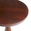 Plinth style side table made from warm-toned wood with round top
