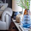 Blue coloured glass vase in curved design