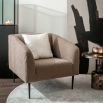 An elegant square shape armchair with sumptuous upholstery