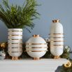 Ravishing round vase with gold rings