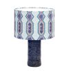 A luxury lampshade by Eva Sonaike with a blue African-inspired pattern