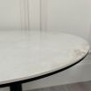 Elegant round bar table with chipped ceramic top