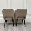 Classic and chic set of 2 dining chairs from Eichholtz upholstered in a greige velvet fabric