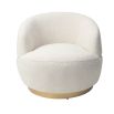 Small and circular boucle sand swivel chair with rounded edges and brass base