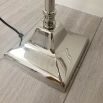Nickel swing arm floor lamp with white shade