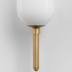 Luxurious brass wall light with opal coloured glass