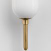 Luxurious brass wall light with opal coloured glass