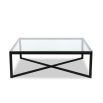 Black frame coffee table supporting clear glass top