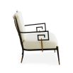 Black framed armchair with brass accents and linen seat and back cushions