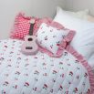 kids quilt and cushion set with cherry design and ruffled striped edges